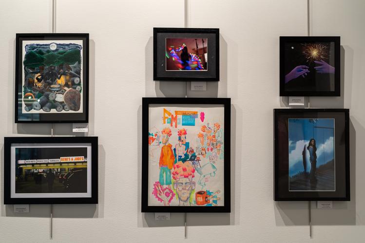 An arrangement of six framed artworks in different media