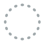 Chairs arranged in a circle with a table at the back.