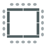 Tables arranged in a rectangle with chairs along the outer perimeter.