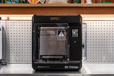 3D Printer machine sitting on top of a countertop