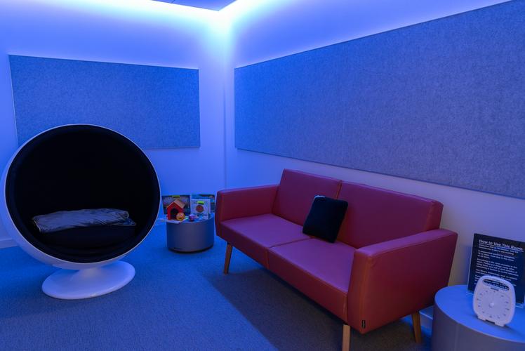 Kids' Sensory Break Room with blue light on, circular chair, and couch