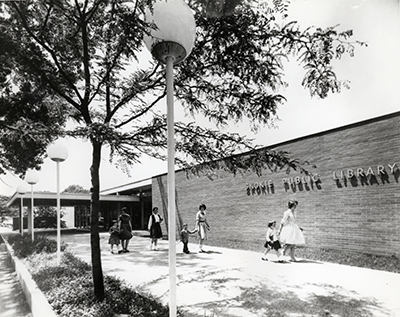 A black and white photograph of the Skokie Public Library from 1960