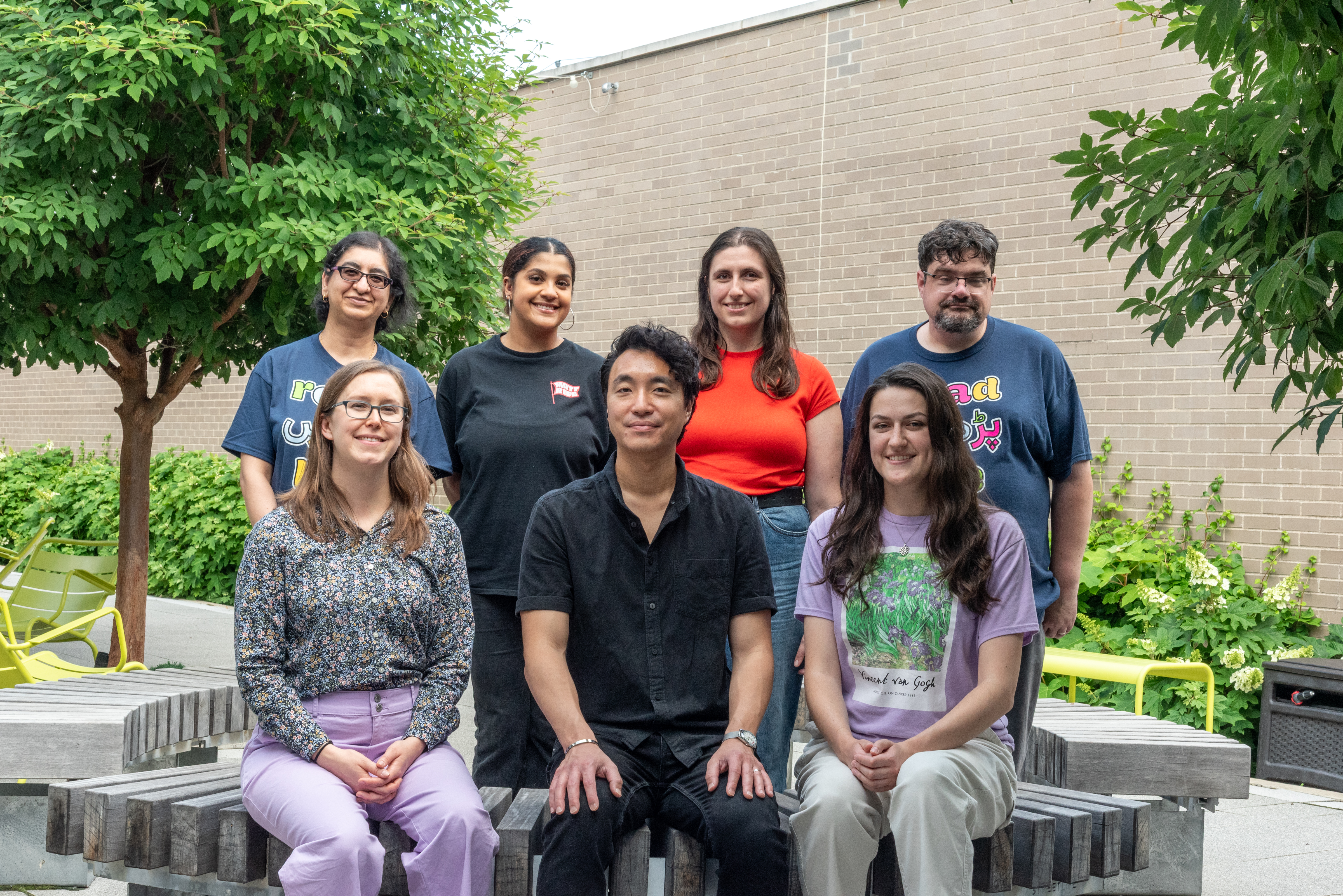 Advisory Staff seated and standing outdoors and smiling for the camera