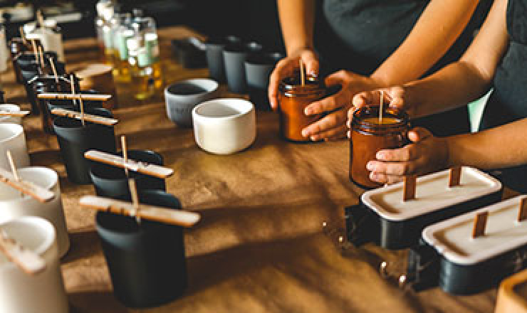 hands making DIY candles