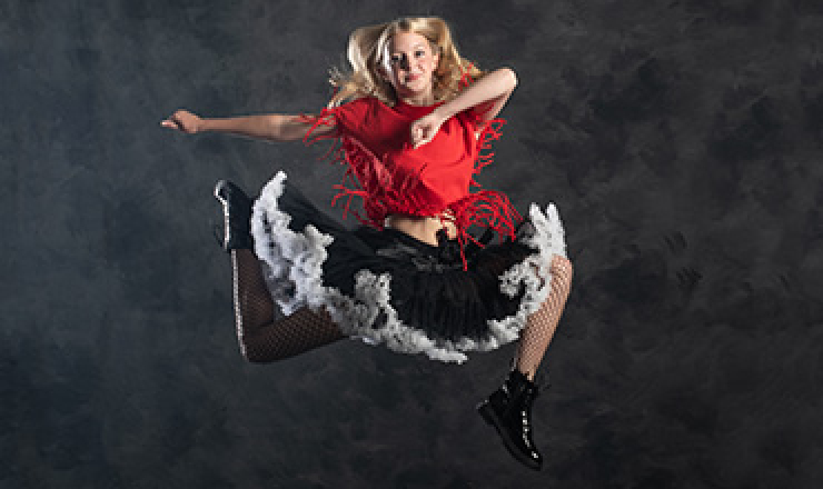 a young dancer is midair