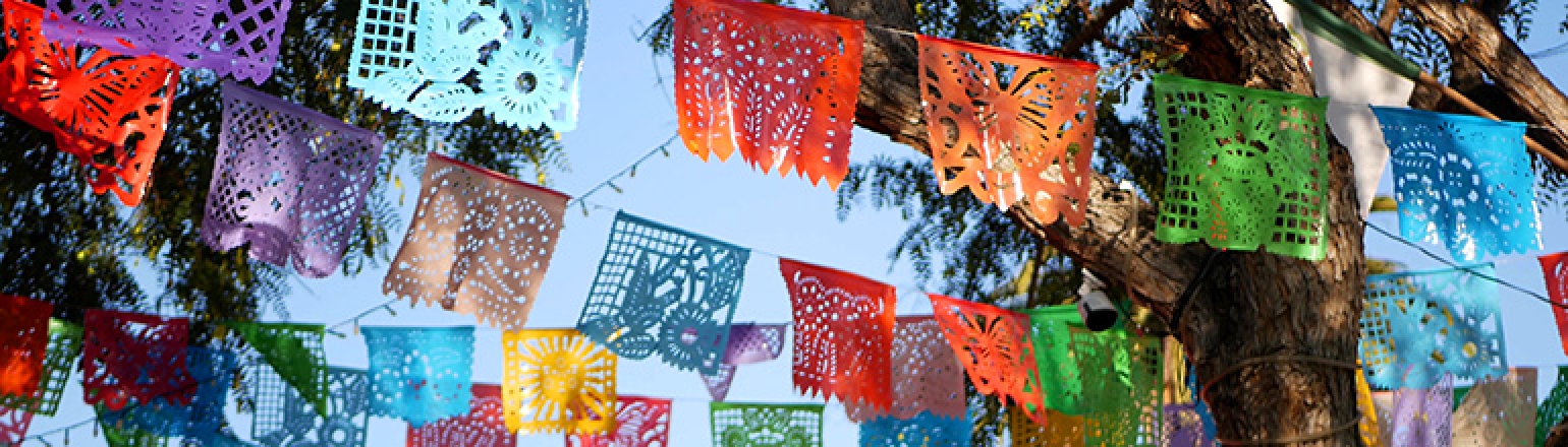 papel picados hanging from a string