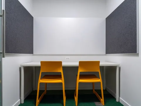 Study Room with table, chairs, and a whiteboard. 