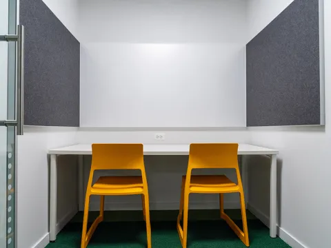 Study Room with table, chairs, and a whiteboard.