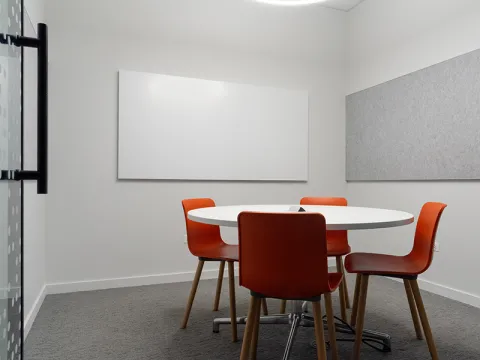 Study Room with table, chairs, and a whiteboard.
