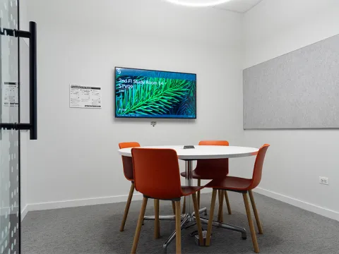 Study Room with table, chairs, and a display screen.