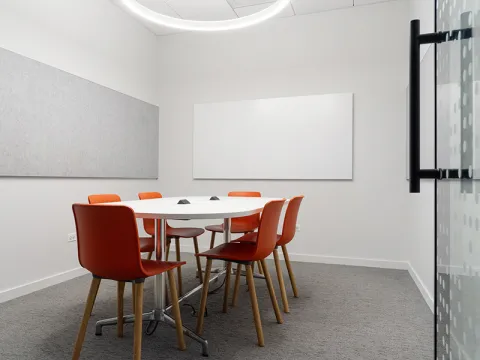 Study Room with table, chairs, and a whiteboard.