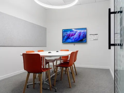 Study Room with table, chairs, and a display screen.