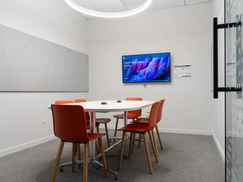 Study Room with table, chairs, and a display screen.