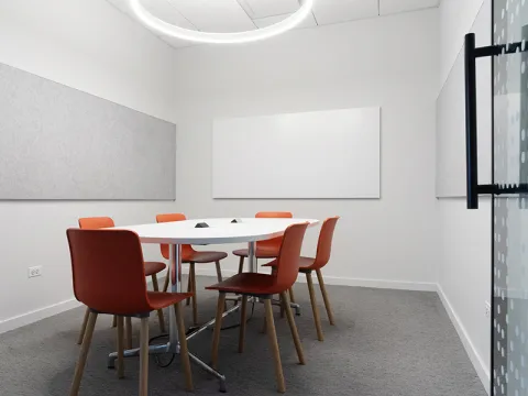 Study Room with table, chairs, and a whiteboard.