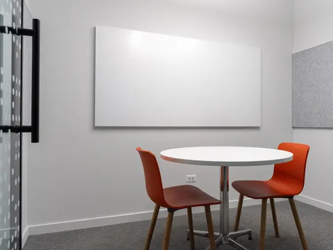 Study Room with table, chairs, and a whiteboard.