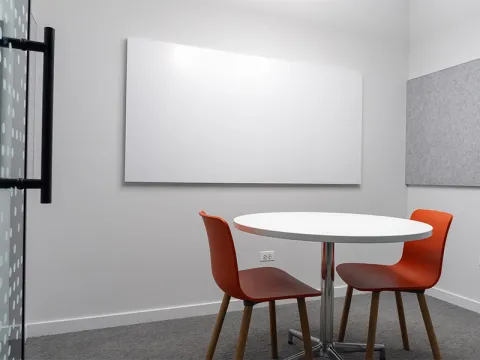 Study Room with table, chairs, and a whiteboard.