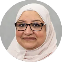 Round portrait of a woman with black glasses and her head covered