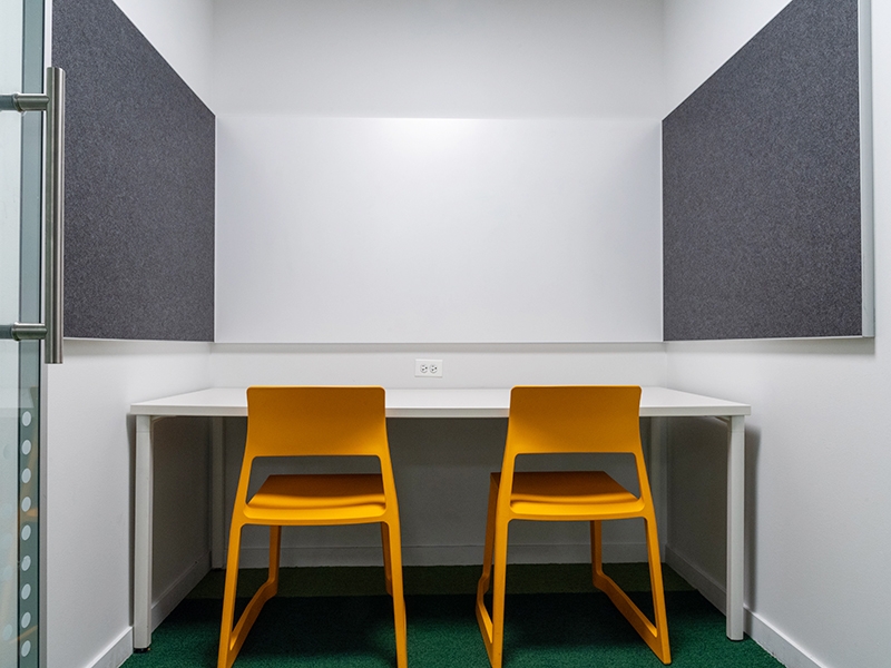 Study Room with table, chairs, and a whiteboard.