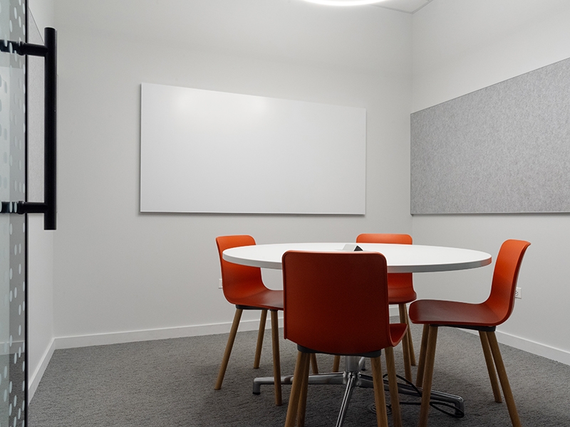 Study Room with table, chairs, and a whiteboard.