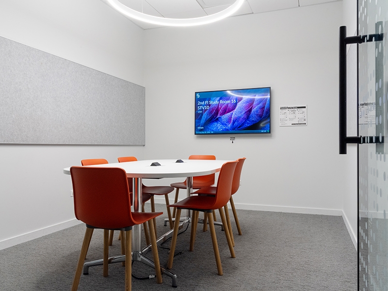 Study Room with table, chairs, and a display screen.