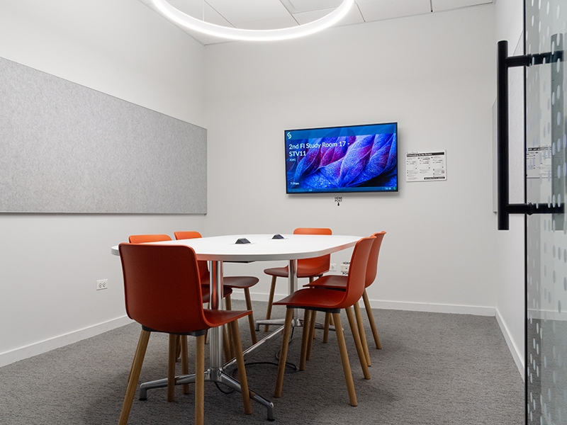 Study Room with table, chairs, and a display screen.