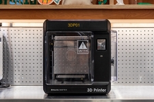 3D Printer machine sitting on top of a countertop