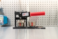 Button Maker (1.25") machine with a red handle