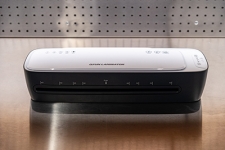 Thermal Laminator machine sitting on a wooden desk