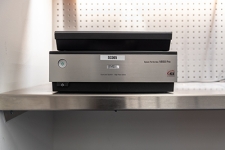 Photo Scanner machine sitting on a metal desk