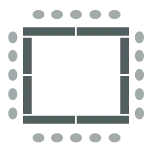 Tables arranged in a rectangle with chairs along the outer perimeter.